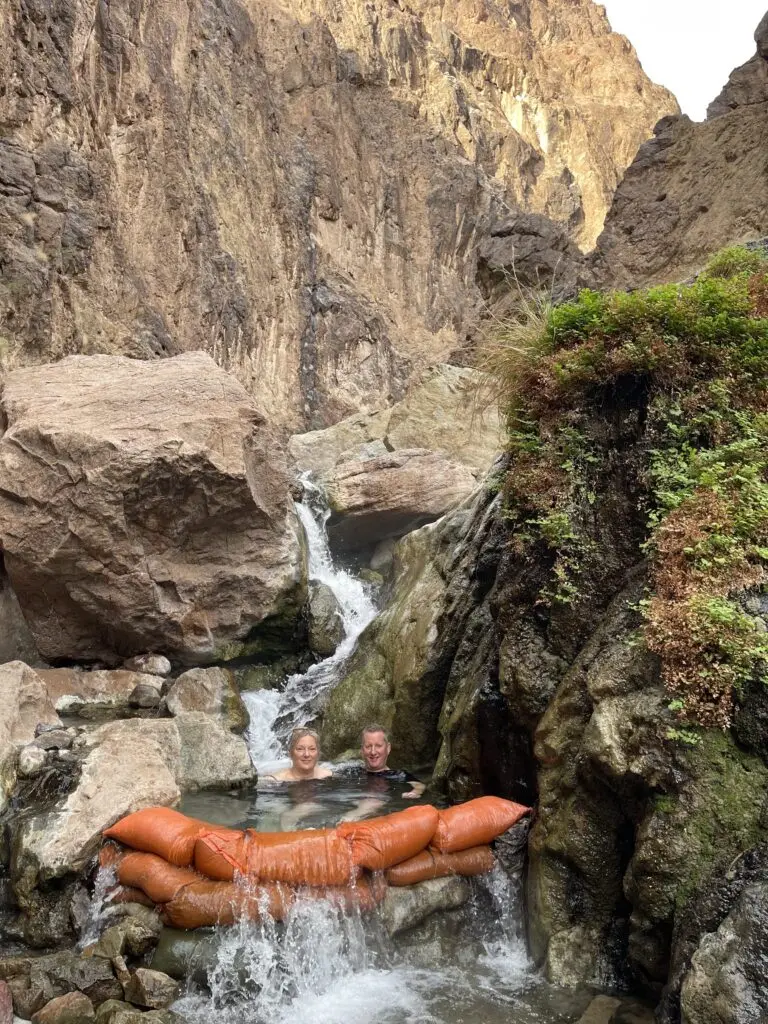 Blazing paddles couple enjoys the hot spring on their trip.