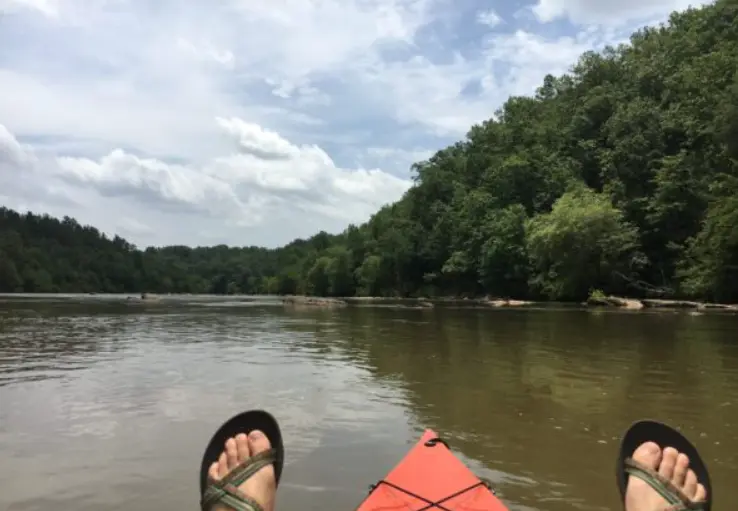 A kayakers feet on Broad River.