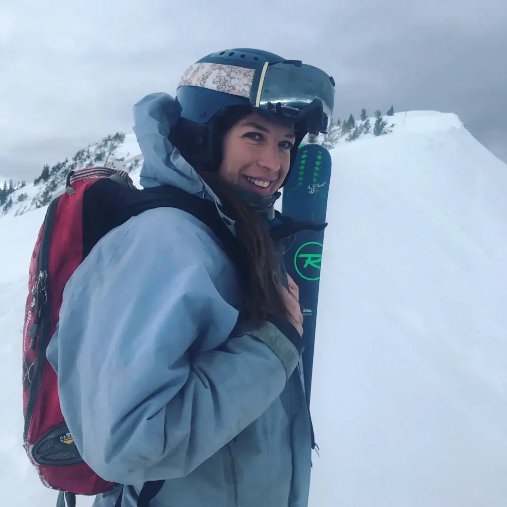 Lynn Barlow on a mountain back country skiing.
