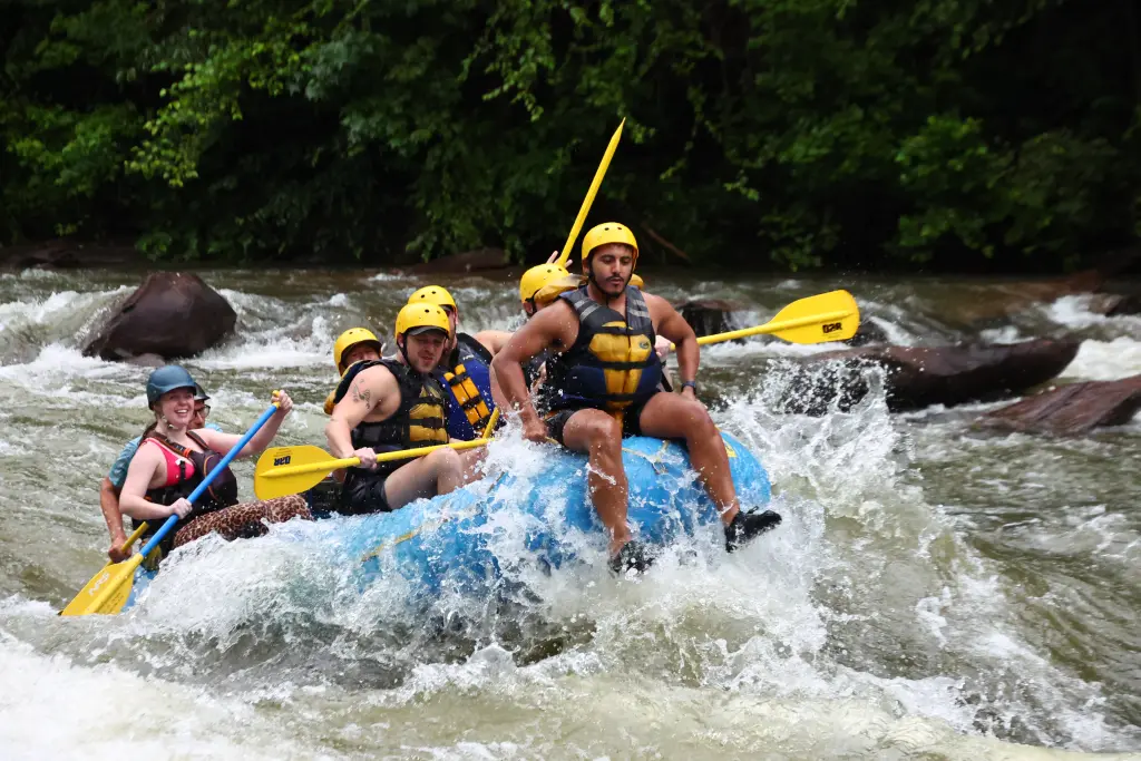 A blue raft full of people.