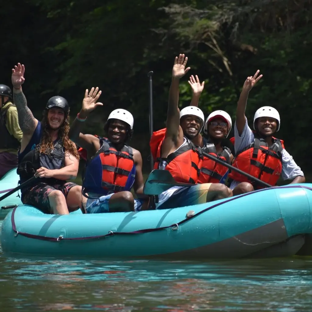 Rafters waving to the camera on the Ocoee River.