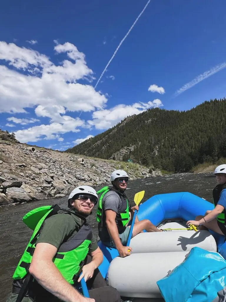Rafters on Clear Creek with mountains in background.