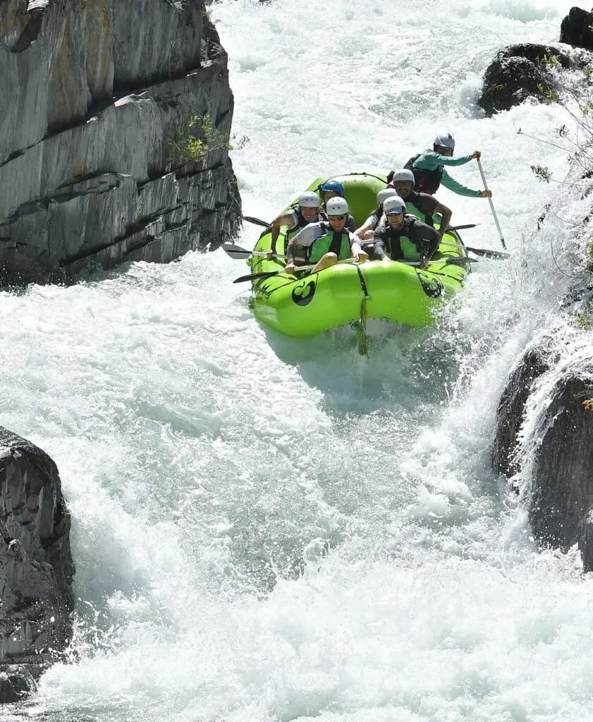 A raft going through Tunnel Chute Rapid on The American River.